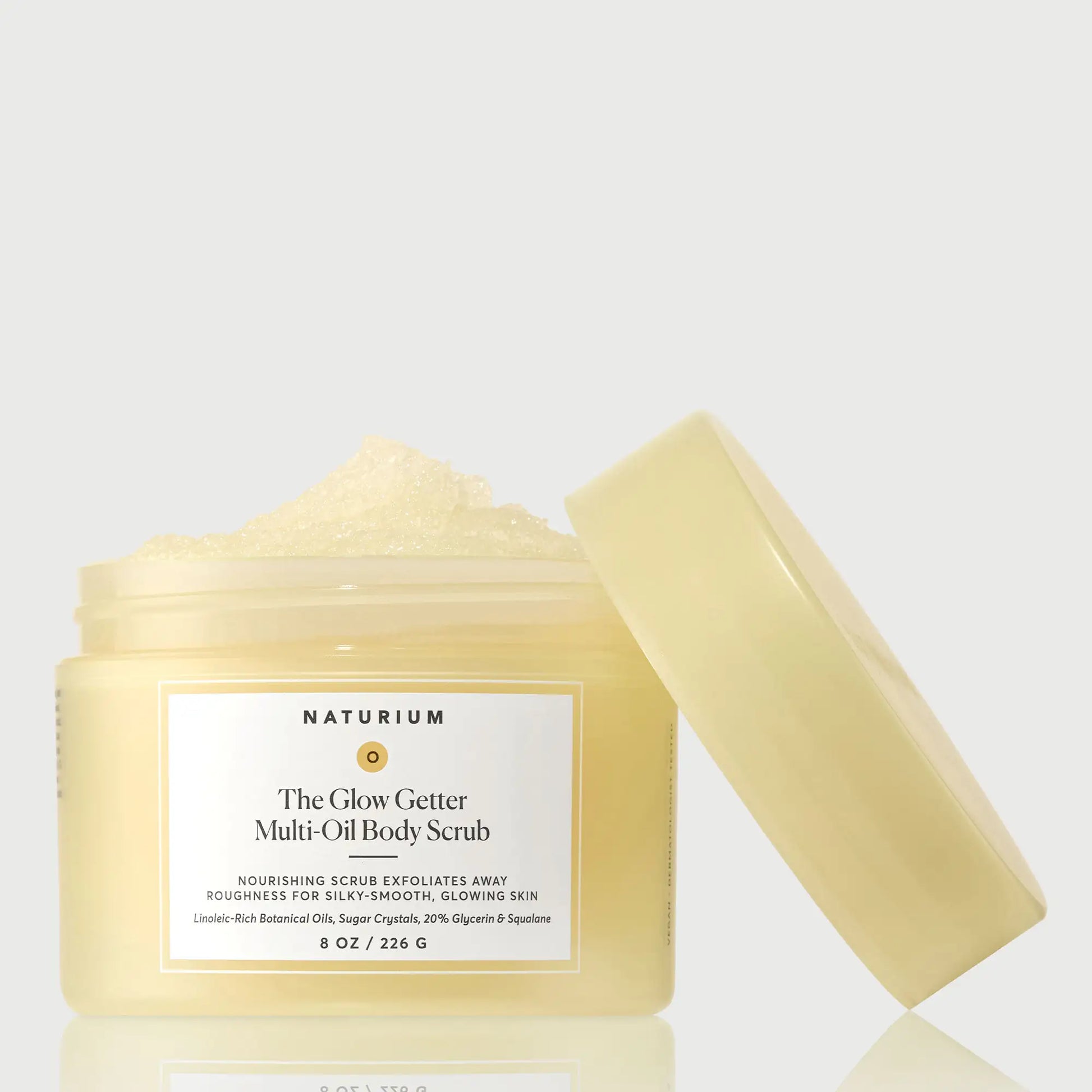 the-glow-getter-multi-oil-body-scrub-z1 NATR-40028-GlowGetter-Multi-Oil-Body-Scrub-Front-CapOff-bonebkgd.webp